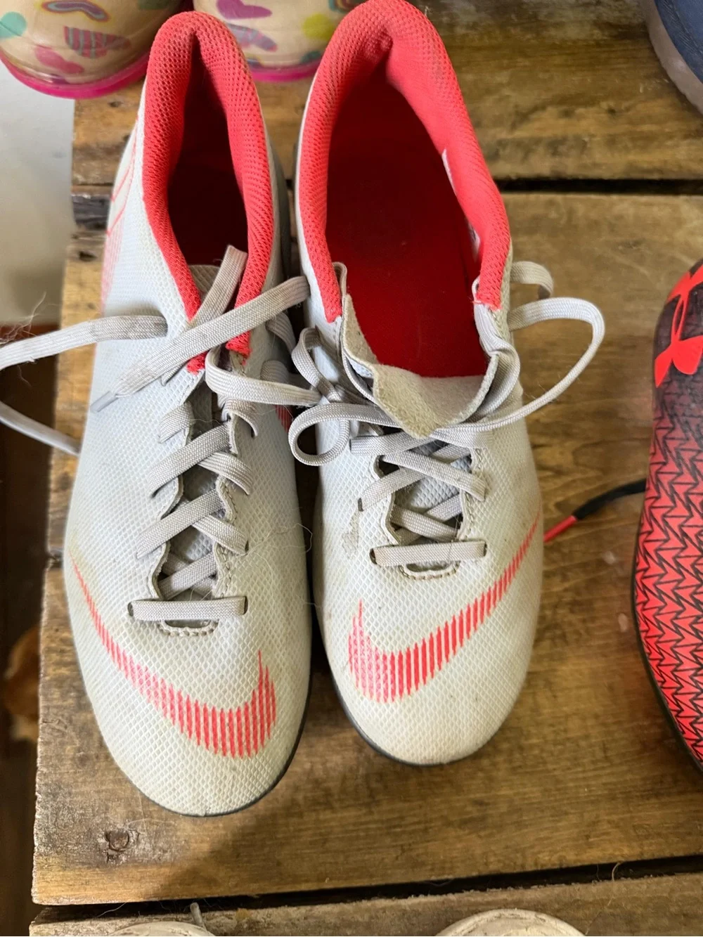 Nike Light Gray Soccer Cleats with Orange Accents